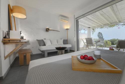 a room with a table with a bowl of fruit on it at Olivemare in Katelios