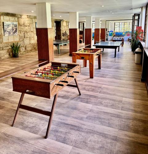 a room with several tables and billiards at Hotel Fazenda São Moritz in Teresópolis