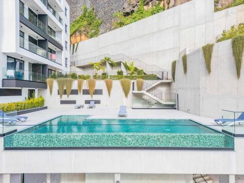 a swimming pool in the middle of a building at CENTRAL LOCATION - WITH POOL in Funchal