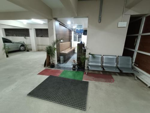 a parking lot with a car parked in a garage at Hotel Classic Comfort in Bengaluru