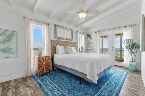 En eller flere senge i et værelse på Bama Breeze