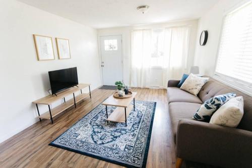 a living room with a couch and a table at Stylish & Cozy Home in Dayton-Close to Everything! in Dayton