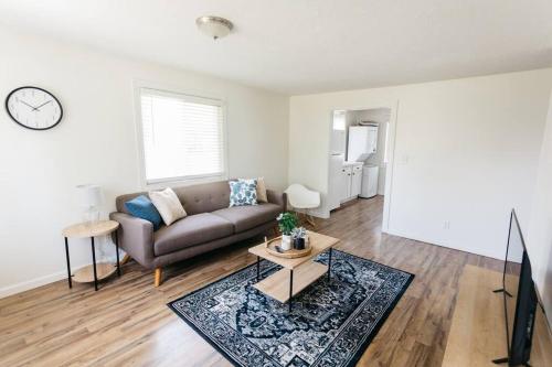 a living room with a couch and a table at Stylish & Cozy Home in Dayton-Close to Everything! in Dayton