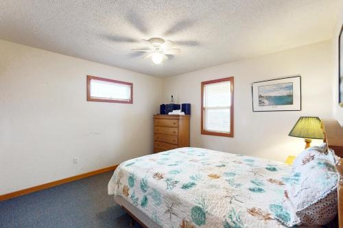 a bedroom with a bed and a ceiling fan at The Beacon 95 in Avon