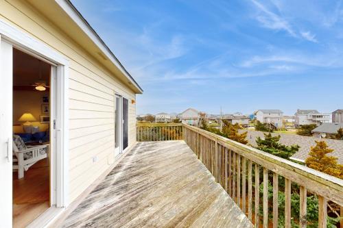a balcony with a view of a house at The Beacon 95 in Avon