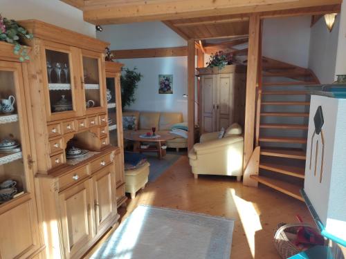 a living room with a staircase in a house at Tauern Haus in Untertauern