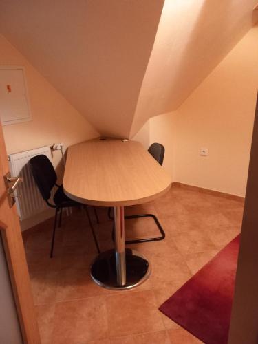 a table and chairs in a small room at Jaroslav Ambrož Elvomont Chlum u Třeboně in Chlum u Třeboně