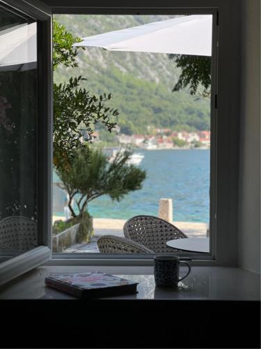 a view of the water from a window at Casa Spada by Belsize in Kotor