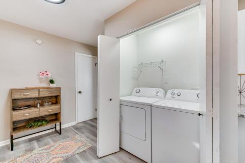 a white laundry room with a washer and dryer at Pet-Friendly Mableton Home with Grill and Fire Pit! in Mableton