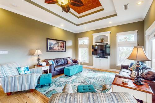 a living room with a couch and a table at Reel Memories in St. George Island