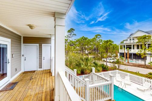 a home with a large deck with a swimming pool at Reel Memories in St. George Island
