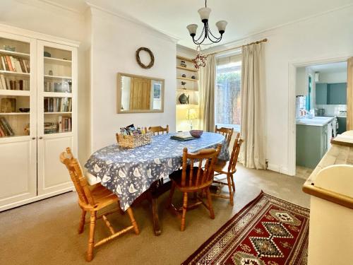 a dining room with a table and chairs at Nunmill Nest By Bishy Road With Free Parking in York