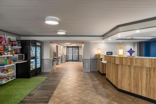 a lobby of a store with a counter and a pharmacy at Spark by Hilton Sarasota Siesta Key Gateway in Sarasota