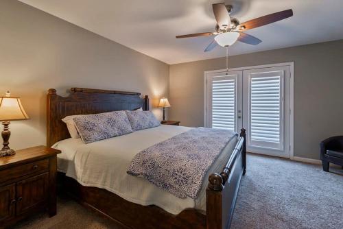 a bedroom with a bed and a ceiling fan at House# 45 The Maine House (No Pets) in Centre