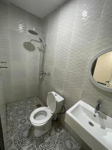 a bathroom with a shower and a toilet and a sink at Bijilo Appartments in Bijilo