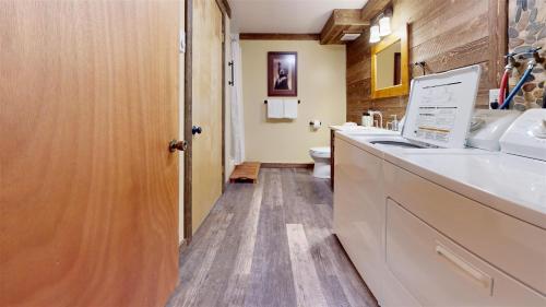 a bathroom with a sink and a toilet at Trapper Condo Unit 7 in West Yellowstone