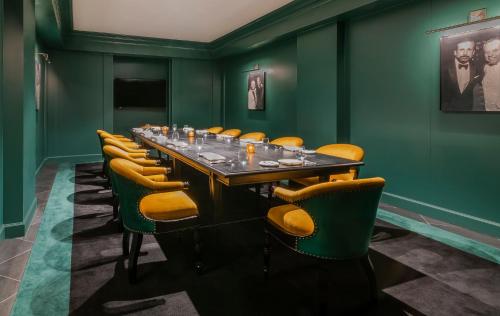 a conference room with a long table and chairs at Rosewood Washington DC in Washington