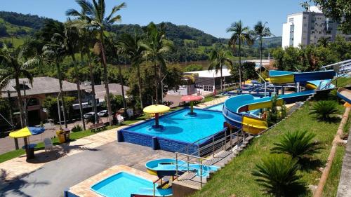 a group of slides at a water park at Apartamento em Marcelino Ramos ao lado das Termas in Belém Velho