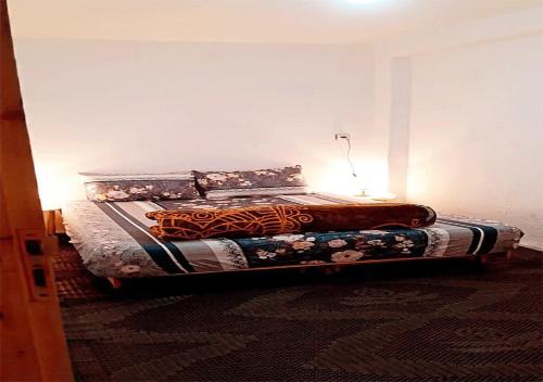 a bed in a room with a bed sidx sidx sidx at Sidi Bouzid Guesthouse in Safi