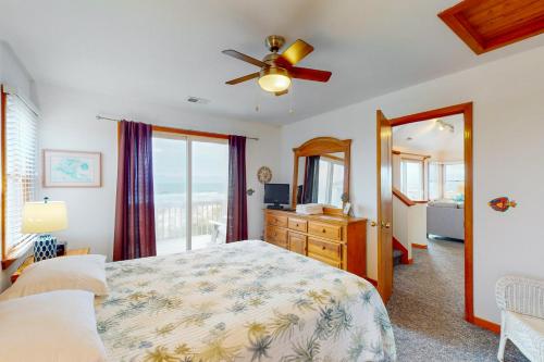 a bedroom with a bed and a ceiling fan at O'Sun #8-K in Avon