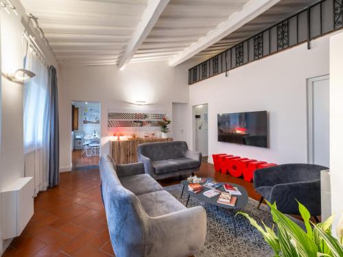 a living room with two couches and a table at Uffizi Suite in Florence