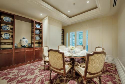 a dining room with a table and chairs at Apricot Hotel in Hanoi