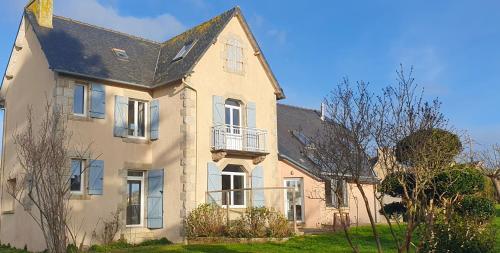 a large white house with a black roof at Hent Ar Mor - Elégante Demeure Trébeurden in Trébeurden