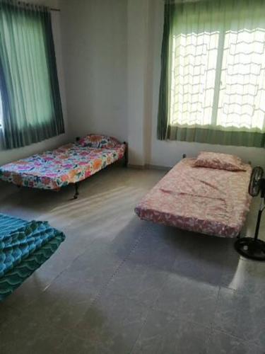 Ένα ή περισσότερα κρεβάτια σε δωμάτιο στο Villa Rosa