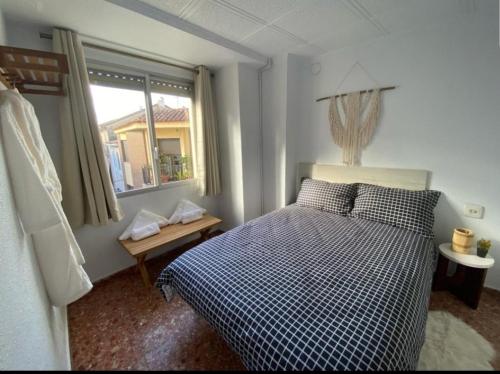 מיטה או מיטות בחדר ב-La Casa Enguera