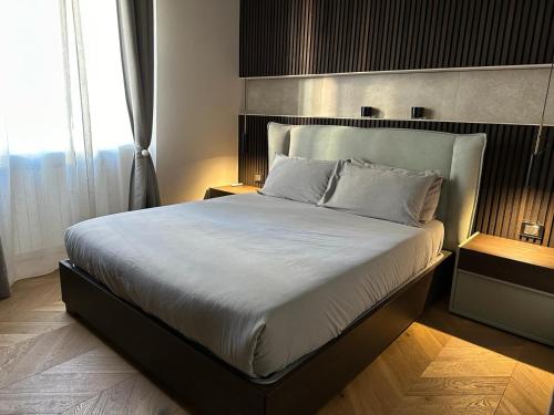 a bedroom with a large bed with white sheets at V28 in Milan