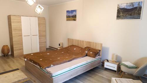 Ένα ή περισσότερα κρεβάτια σε δωμάτιο στο Trinity Apartment