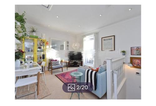 a living room with a couch and a table at Veronika’s in London