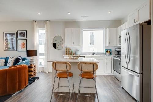 a kitchen with a table and two chairs at Nashville - 5623 Lenox Ave in Nashville