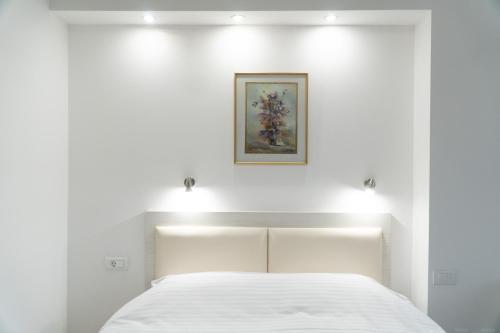 Ένα ή περισσότερα κρεβάτια σε δωμάτιο στο Sienna Residence