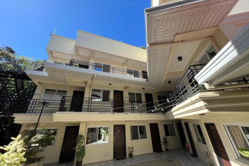 an exterior view of a building with a balcony at Happy Grey Hotel Vigan in Vigan