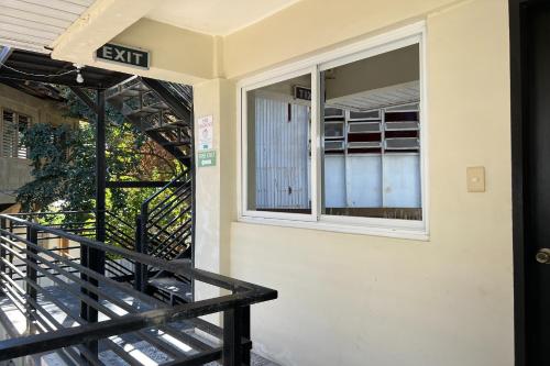 an entrance to a building with a window at Happy Grey Hotel Vigan in Vigan