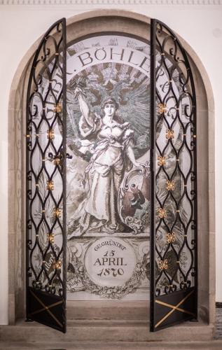a stained glass window with a picture of a woman at Hotel Böhlerstern in Kapfenberg