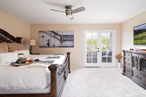 a bedroom with a bed and a ceiling fan at Scottsdale - 6206 N 30th Pl in Phoenix