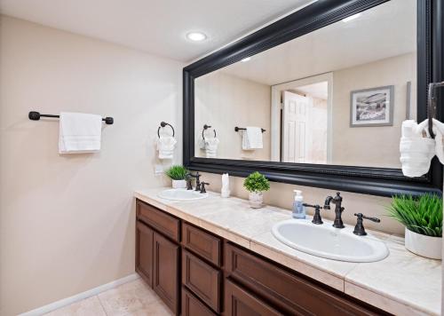a bathroom with two sinks and a large mirror at Scottsdale - 6206 N 30th Pl in Phoenix