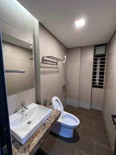 a bathroom with a sink and a toilet at 54 homestay Van Mieu in Hanoi