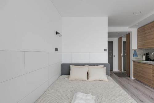 Säng eller sängar i ett rum på Ozo eco apartments 5