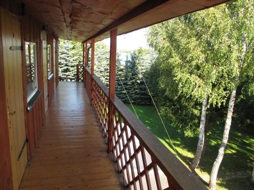 a porch of a house with a view of a yard at Sodyba Brazylija in Taraldžiai