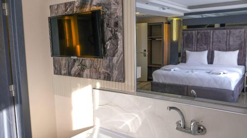 Katil atau katil-katil dalam bilik di TALLES CITY HOTEL