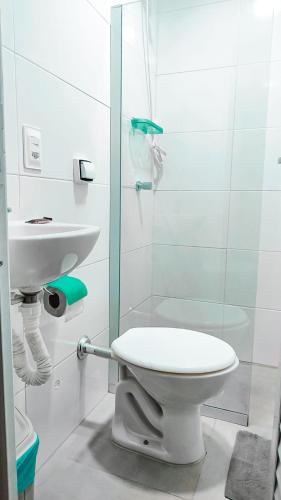 a bathroom with a shower and a toilet and a sink at Hostel Flamengo in Rio de Janeiro