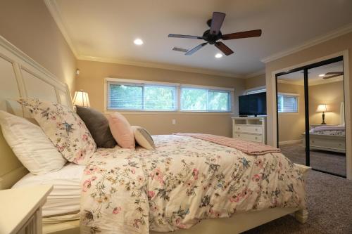 a bedroom with a bed and a ceiling fan at Destination #03 in Fullerton