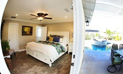 a bedroom with a bed and a swimming pool at Destination #30 in Anaheim