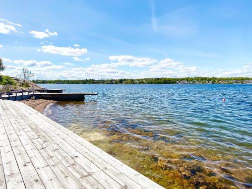 a large lake with a dock on the water at 5 star holiday home in VÄSTERVIK-By Traum in Västervik