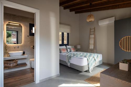 Lithos Villas Apollonにあるベッド