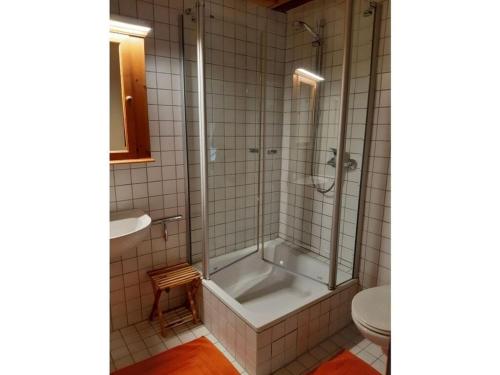 a bathroom with a shower and a tub and a toilet at Lovely apartment in Kobern-Gondorf in Kobern-Gondorf