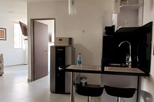 Kuchyň nebo kuchyňský kout v ubytování 503 Moderno Aparta-Suite en Versalles Tipo Loft - Cali Tower Suites & Lofts